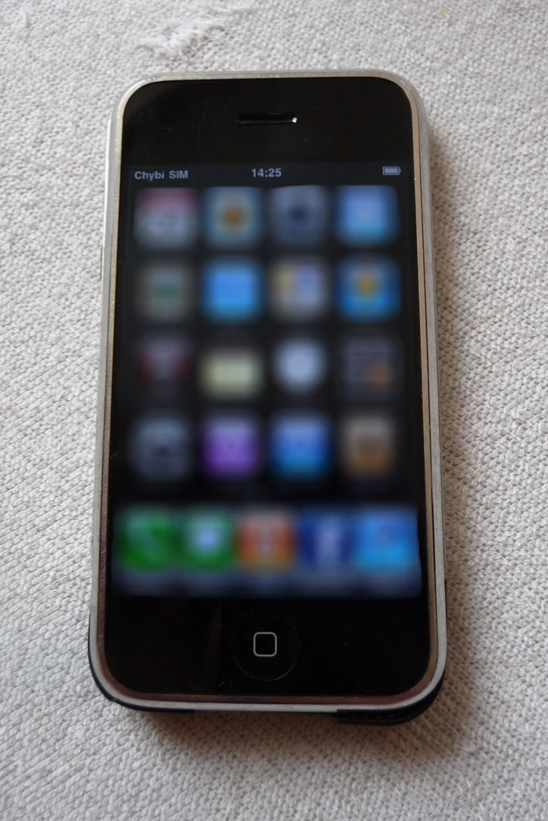 An original 8 GB iPhone showing the iPhone OS 3.1.3 home screen